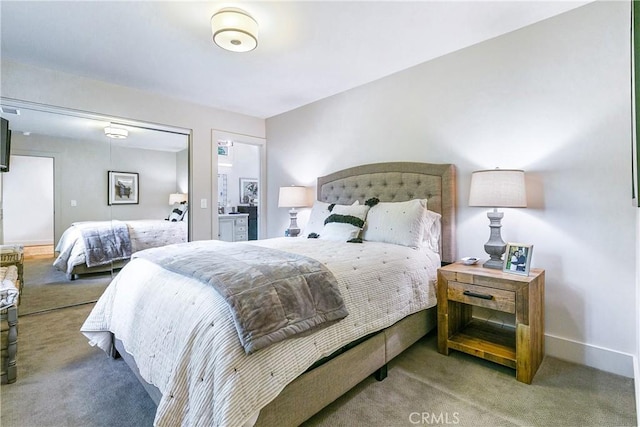 carpeted bedroom featuring a closet