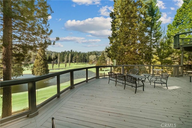 wooden deck featuring a water view