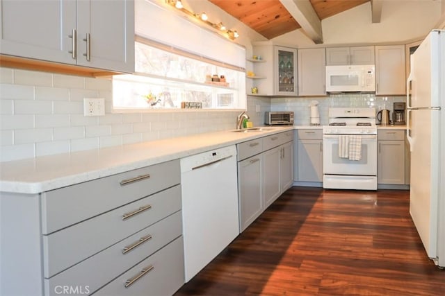 kitchen with tasteful backsplash, vaulted ceiling with beams, sink, dark wood-type flooring, and white appliances