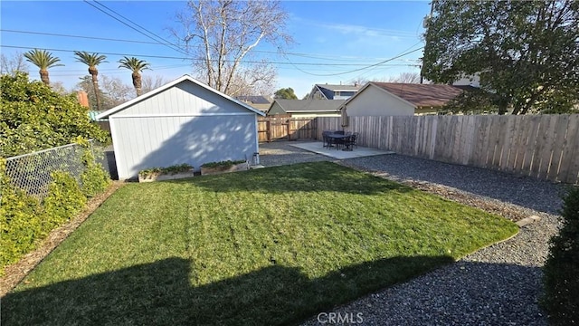 view of yard with an outdoor structure and a patio area