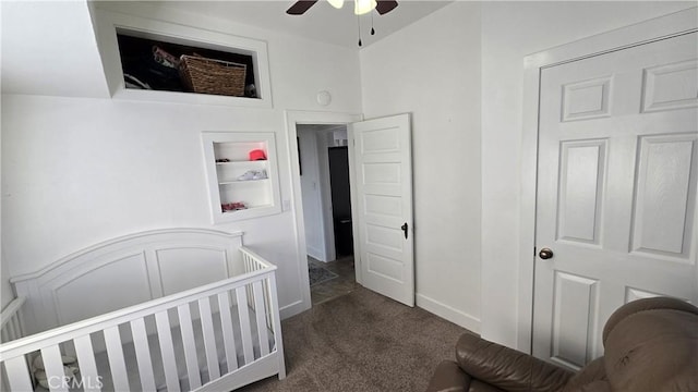 bedroom with ceiling fan and dark colored carpet