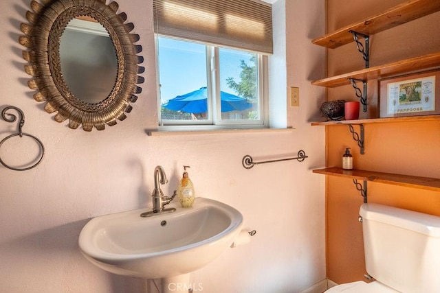 bathroom with toilet and sink