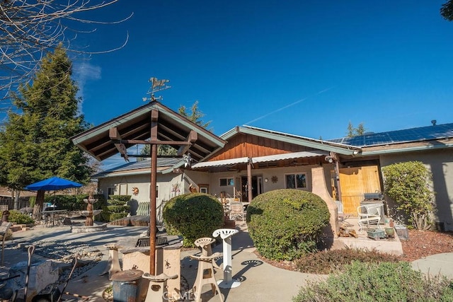 rear view of house with a patio area