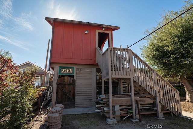 view of front of house featuring a storage unit