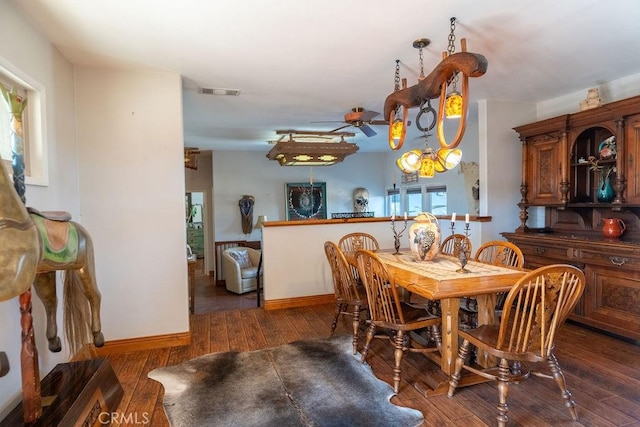 dining area with dark hardwood / wood-style flooring