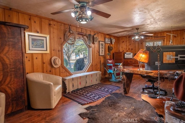 office with hardwood / wood-style floors and wooden walls