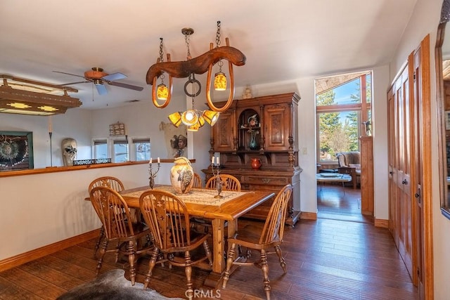 dining room featuring ceiling fan and dark hardwood / wood-style flooring