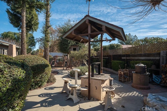 view of patio featuring a playground