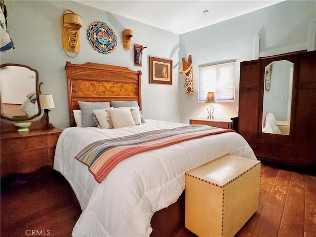 bedroom with wood-type flooring