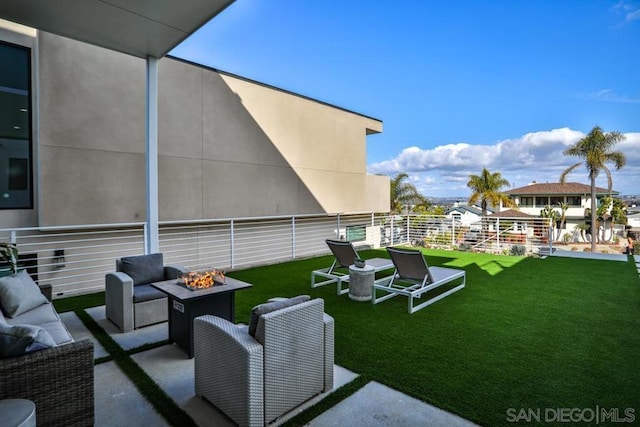 view of patio / terrace with a fire pit