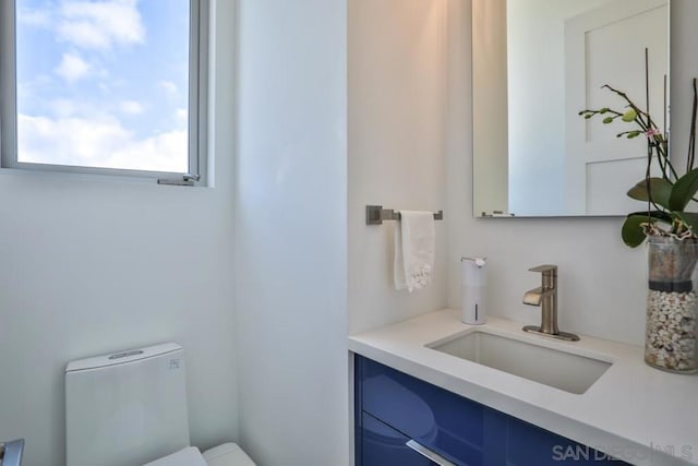 bathroom with vanity and toilet