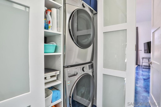 laundry area with stacked washer / drying machine