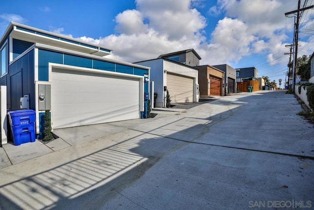 view of side of home featuring a garage