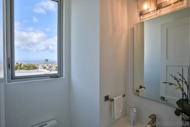 bathroom with a water view