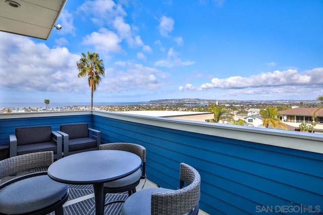 balcony featuring a water view