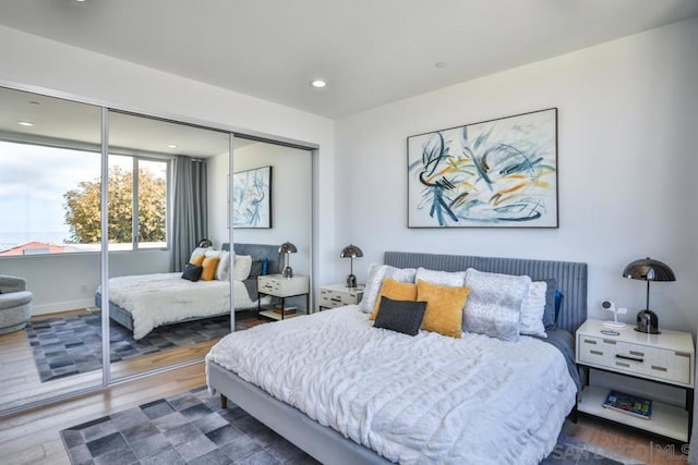 bedroom featuring dark hardwood / wood-style floors and a closet