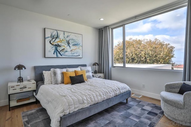 bedroom featuring dark hardwood / wood-style flooring