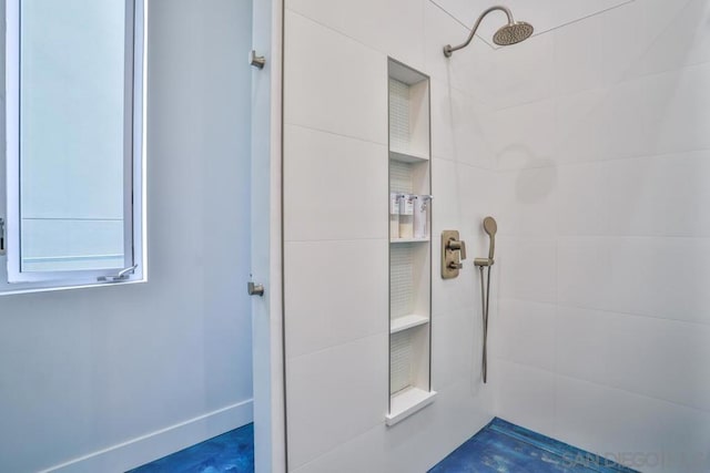 bathroom featuring tiled shower