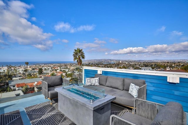 view of patio featuring an outdoor living space with a fire pit