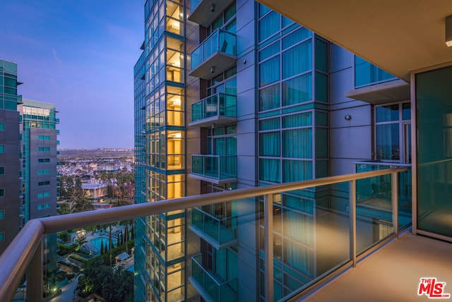 view of balcony at dusk