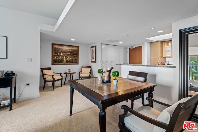 dining area with light colored carpet