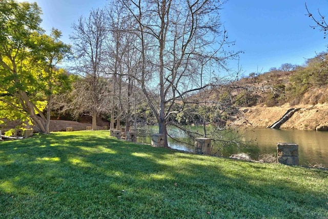 view of yard with a water view