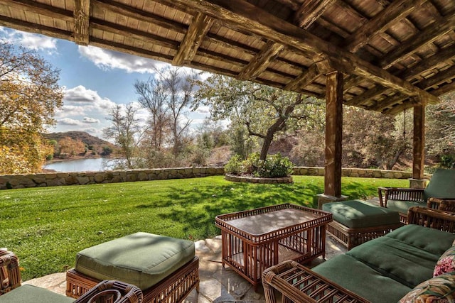 exterior space with a water view and grilling area