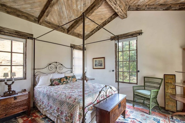 bedroom featuring wooden ceiling and vaulted ceiling with beams