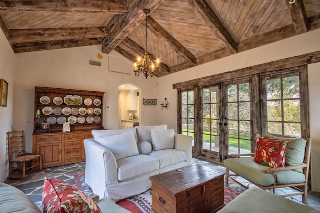 living room featuring wood ceiling, arched walkways, and beam ceiling