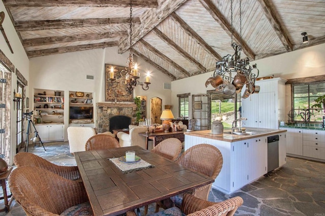 dining room with stone flooring, wooden ceiling, and plenty of natural light