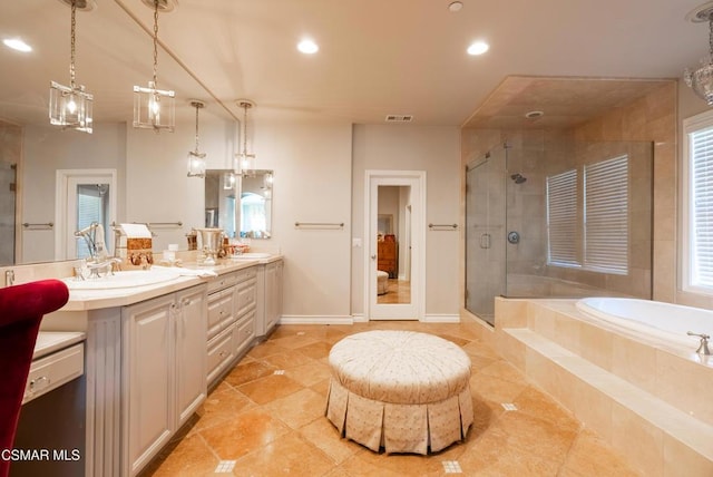 bathroom with vanity and plus walk in shower