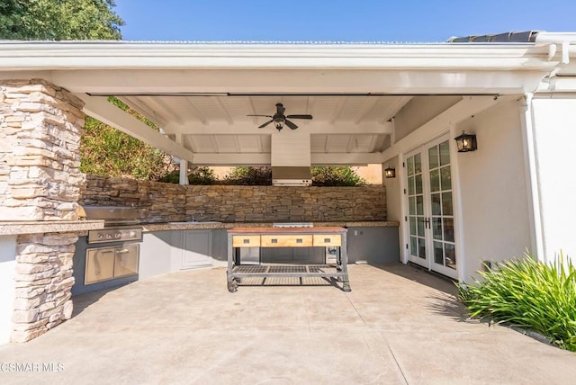 view of patio / terrace featuring exterior kitchen, a grill, ceiling fan, and french doors