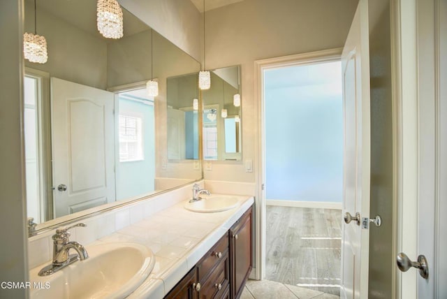 bathroom featuring hardwood / wood-style flooring and vanity