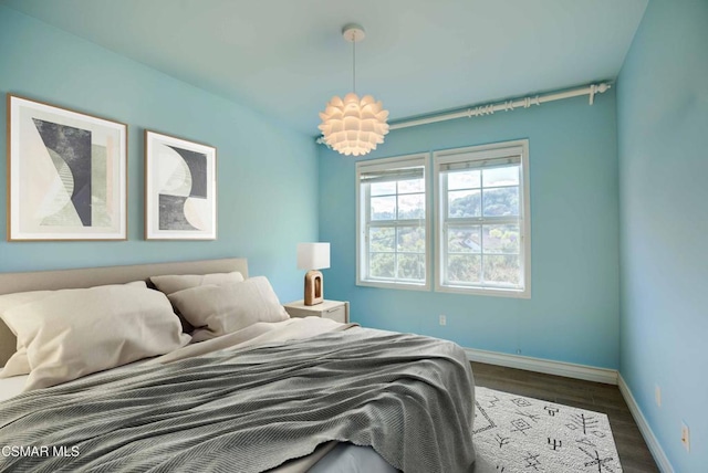 bedroom featuring dark hardwood / wood-style flooring