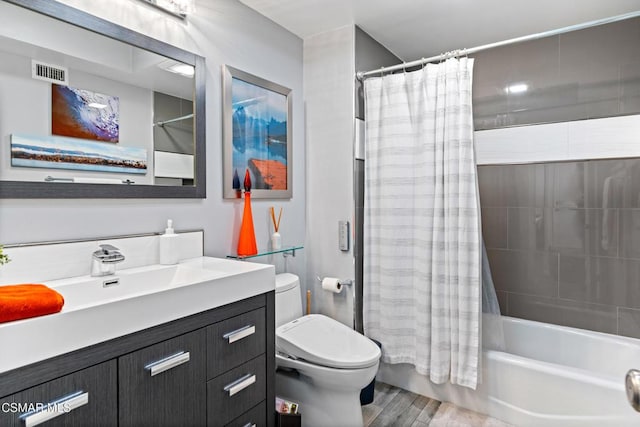 full bathroom featuring shower / tub combo with curtain, vanity, toilet, and wood-type flooring