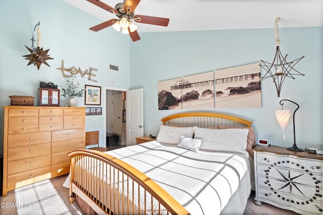 bedroom featuring hardwood / wood-style flooring, ceiling fan, and high vaulted ceiling