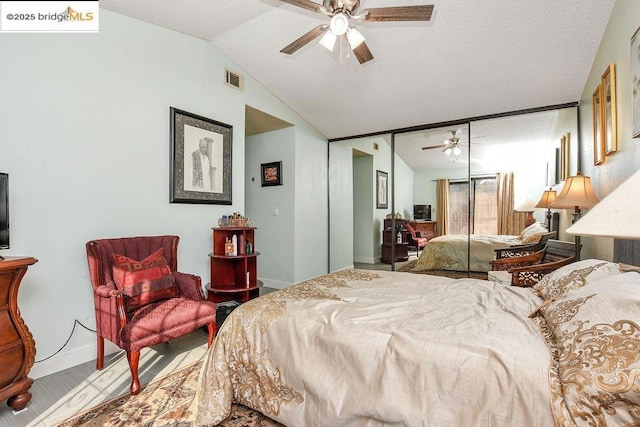 bedroom featuring vaulted ceiling and ceiling fan