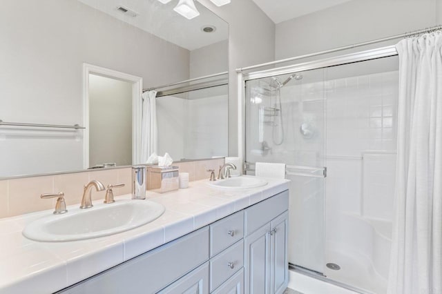 bathroom with vanity and curtained shower