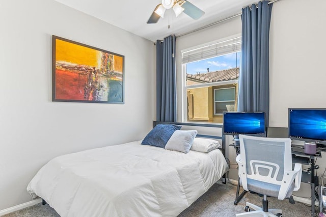 bedroom with baseboards, carpet floors, and a ceiling fan