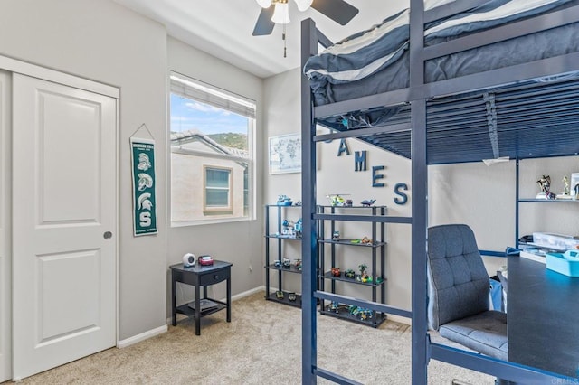 carpeted bedroom with baseboards