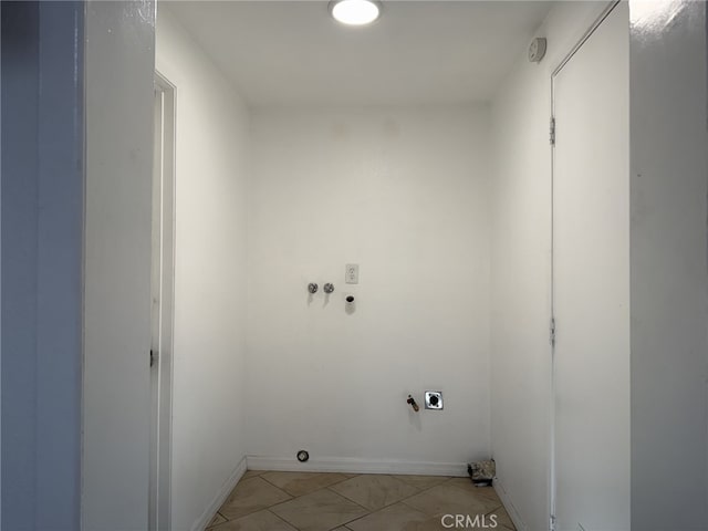 laundry room with light tile patterned floors, hookup for a washing machine, hookup for an electric dryer, laundry area, and baseboards