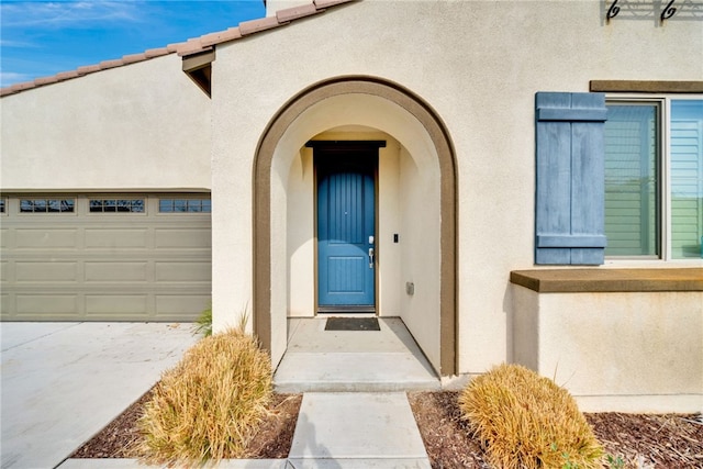 property entrance featuring a garage