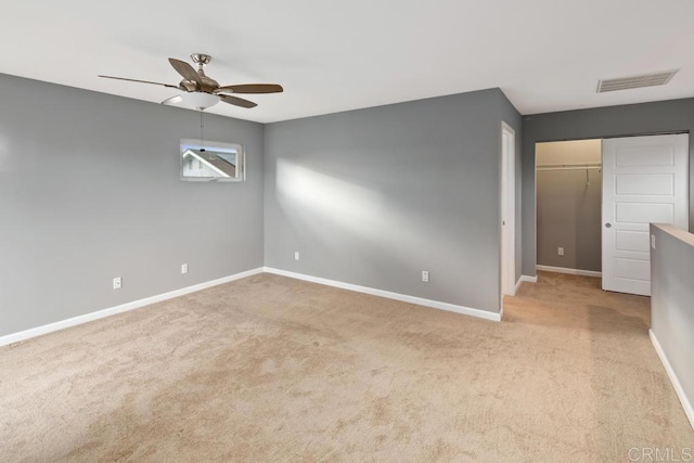 unfurnished bedroom featuring baseboards, visible vents, and carpet flooring