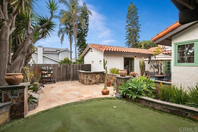 view of patio featuring fence