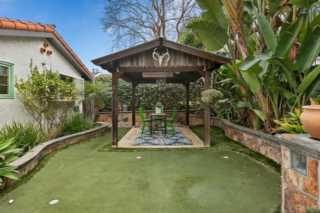 exterior space featuring a patio, a gazebo, and fence