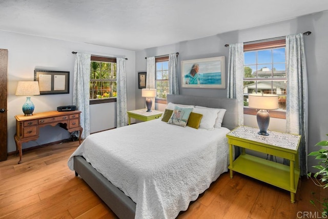 bedroom with hardwood / wood-style floors