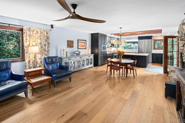 interior space featuring ceiling fan and light wood-style flooring