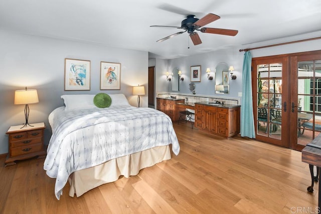 bedroom featuring access to outside, french doors, a ceiling fan, and light wood-style floors