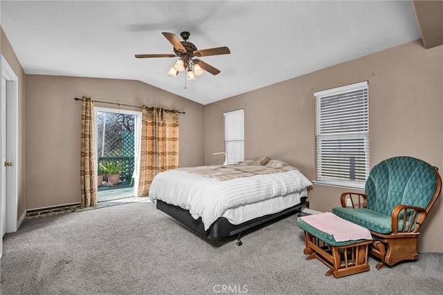 carpeted bedroom featuring lofted ceiling, access to outside, multiple windows, and a ceiling fan