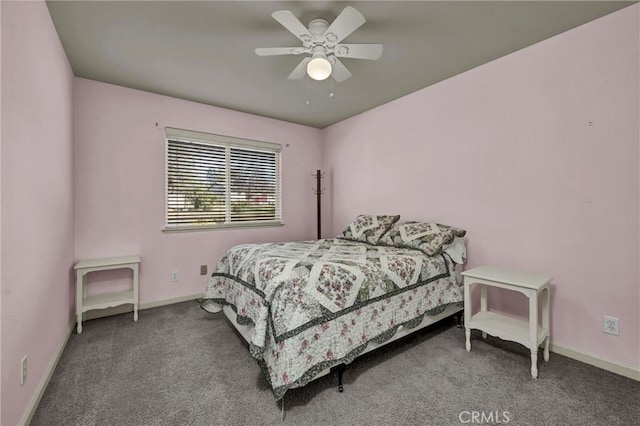 carpeted bedroom featuring baseboards and a ceiling fan